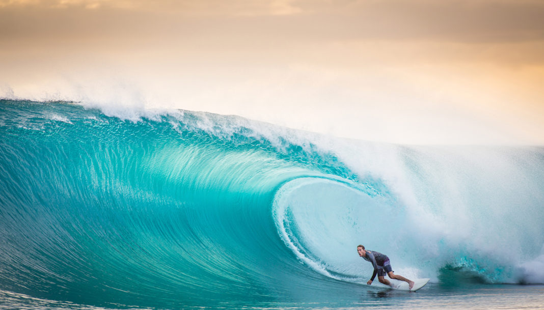 Surfing a the perfect wave in Indonesia banks