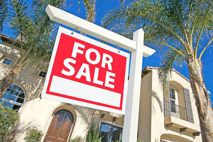 Sold Home For Sale Sign and New House residential real estate