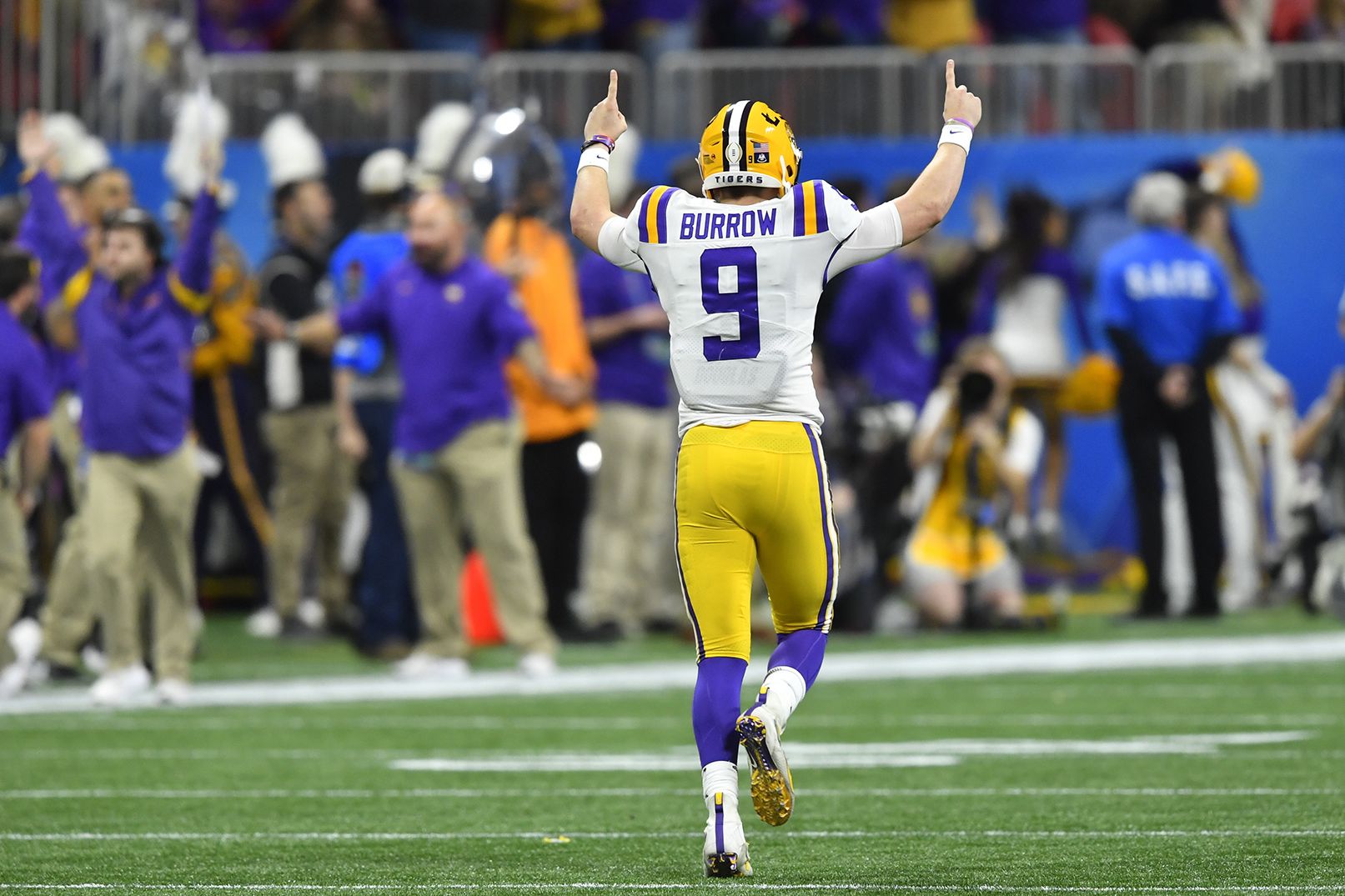 Joe Burrow LSU Tigers Unsigned White Jersey Warming Up At Night Under The  Spotlights Photograph