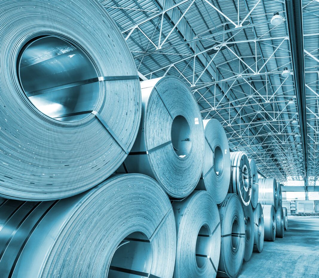 Industrial warehouse. Cold rolled steel coil in warehouse of plant. Production of steel sheets in rolls